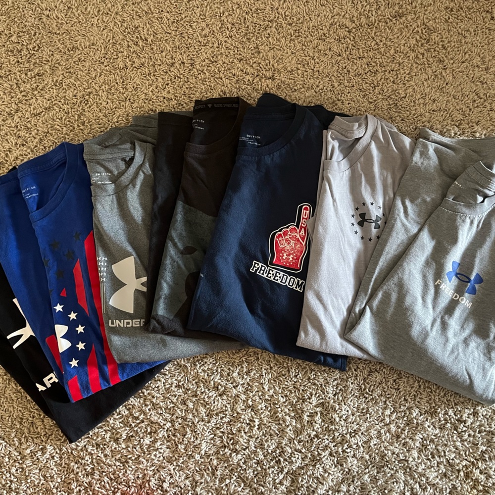 Men’s Medium Under Armour shirts.